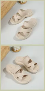 Detail view of beige platform sandals featuring cross straps and adjustable velcro closure