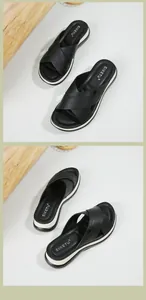 Detailed top view of black leather cross strap platform sandals with durable white soles