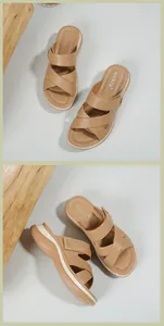 Detail of nude platform wedge sandals featuring crisscross straps and side buckles