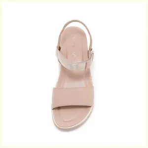 Overhead view of soft pink platform sandals with metallic accents and cushioned footbed