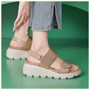 Side view of beige wedge sandals with rhinestone straps and chunky white platform sole