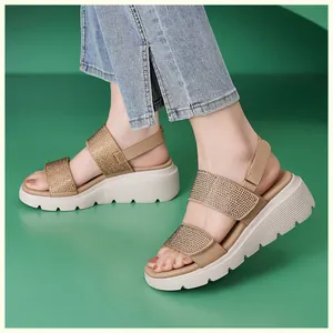 Detailed view of women's beige wedge sandals with sparkling rhinestones and non-slip sole