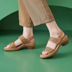 Detail showing khaki wedge sandals with rhinestone straps and velcro heel strap