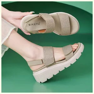 Detailed view of women wedge sandals with rhinestone straps and velcro closure