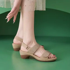 Detail of apricot wedge sandals with rhinestones and adjustable velcro strap