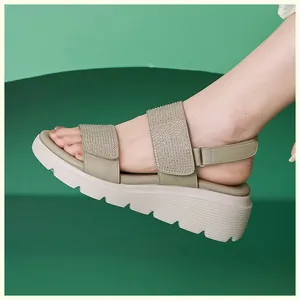 Close-up of rhinestone double straps on summer wedge sandals with anti-slip platform soles