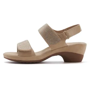 Close-up of khaki platform sandals with rhinestone straps and velcro ankle closure