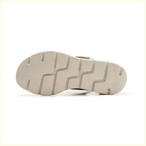 Detailed view of the anti-slip geometric texture on the wedge sandal's EVA outsole