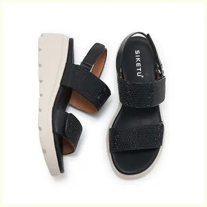 Close-up of black rhinestone straps on women wedge sandals with non-slip thick soles