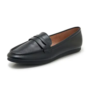Detail of the black matte leather upper and classic penny strap on women's loafers