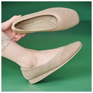Macro detail of breathable knit ballet flats with champagne rhinestones and wedge sole