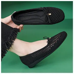 Detail of black woven mesh ballet flats with delicate bow and comfortable soft padding