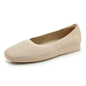 Detailed view of apricot knit flat shoes featuring sparkling rhinestone embellishments