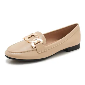 Elegant beige leather loafers for women with gold metal buckle detail and flat sole