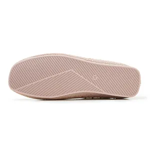 Close-up of lightweight non-slip rubber sole with size 36 engraving on knitted flat shoes