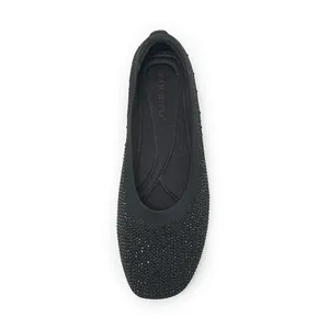 Top view of black knitted flat shoes with shimmering rhinestones and soft SIKETU insole