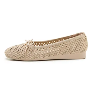 Close-up of beige woven mesh ballet flats featuring a delicate bow and breathable knit
