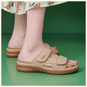 Close-up of beige wedge sandals with adjustable velcro straps and cushioned soles
