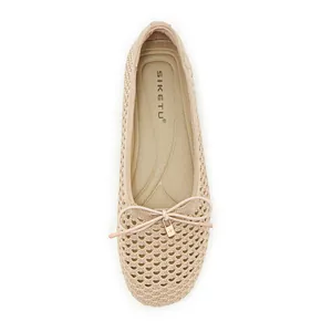 Top view of beige hollow knit ballet flats featuring soft bow and gold lock charm