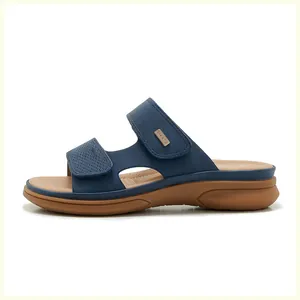 Macro shot of navy blue textured straps with adjustable velcro closure on wedge sandals