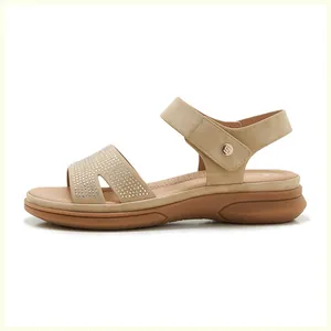 Detailed close-up of beige platform sandal featuring sparkling rhinestone strap and buckle