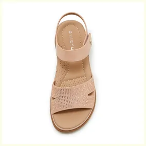 Detailed macro view of pink sandals with rhinestones and comfortable breathable insoles