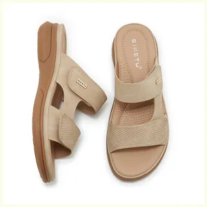 Detail of wedge sandals showing adjustable velcro straps and breathable massage insoles