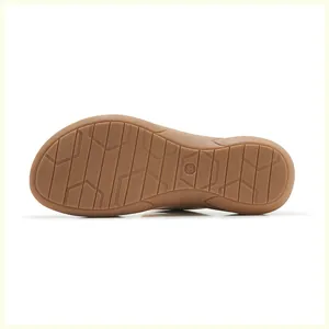 Detail shot of wedge sandal rubber sole with geometric anti-slip pattern and size 36 mark