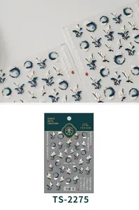 Detail of 3D embossed nail stickers featuring traditional ink wash floral art and blue waves