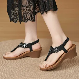 Women's wedge thong sandals featuring black rhinestone flowers and comfortable elastic back strap