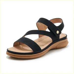 Detail view of black summer wedge sandals with metallic buckle and size 36 marking