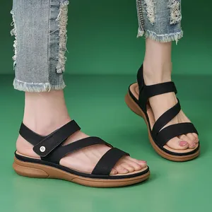 Women's black wedge sandals with cross straps and adjustable ankle velcro closure