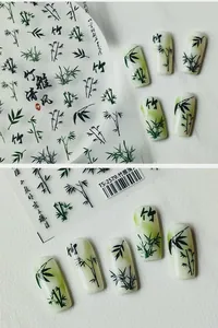 Detailed view of TS-2579 nail decals featuring elegant green and black bamboo ink art