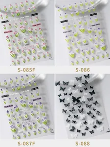 Detailed macro view of 3D embossed tulip and butterfly nail art stickers in four styles