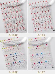 Detail showing 3D embossed nail art stickers with tulip and colorful heart patterns
