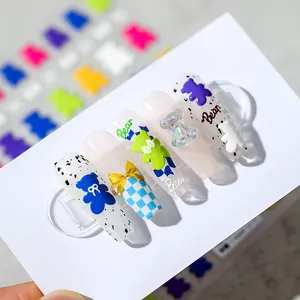 Long nail art stickers with 3D resin bears and blue checkered designs on white base