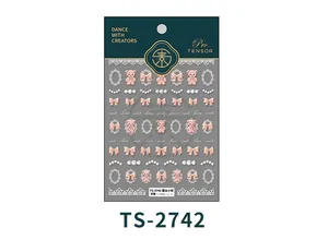Detailed macro view of 5D embossed nail stickers featuring lace bears and bows