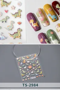 Macro detail of 3D embossed cartoon dinosaur nail art stickers with colorful patterns