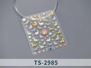 Detail of colorful dinosaur nail art stickers with glossy embossed 3D textures on a sheet