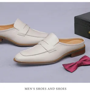 Detail of ivory leather loafers mules for men featuring a classic strap design