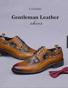 Detailed view of brown cowhide Brogue shoes with elegant gold floral embroidery