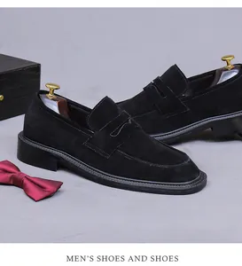 Detail of black suede loafers with moccasin stitching and premium shoe trees for men