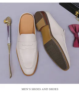 Detailed top view of off-white leather penny loafers with anti-slip diamond texture sole