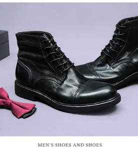 Detailansicht der schwarzen Lederstiefel mit klassischer Kappe und feinen Nähten