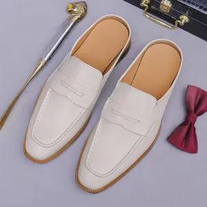 Men's off-white leather penny loafer mules with premium stitched soles and vintage props