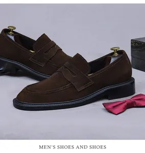 Detail view of premium dark brown suede leather penny loafers with elegant shoe tree