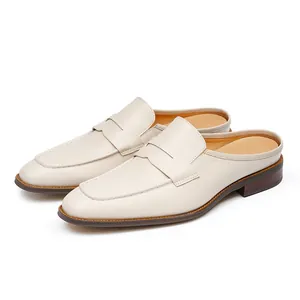 Beige leather mule loafers for men with hand-stitched detailing and vintage finish