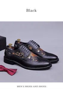 Detailed embroidery on black leather oxfords featuring floral patterns and brogue detailing