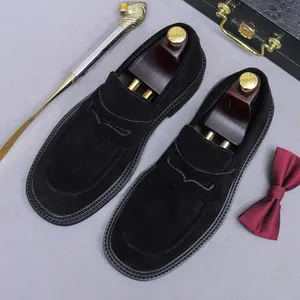 Classic black suede penny loafers for men featuring premium leather and moccasin stitching