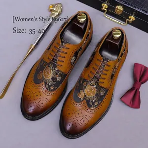 Brown leather brogue shoes with gold rose embroidery and classic wingtip details